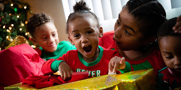 family opening Christmas presents